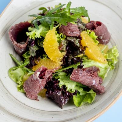 Herb Salad Topped With Orange Ham Slices